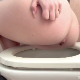 A woman is recorded from a side perspective as she takes her morning shit into a toilet. Presented in 720P HD. Over half a minute.